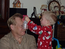 P1030135 Thomas Attends To Daddy's Hair On New Year's Eve